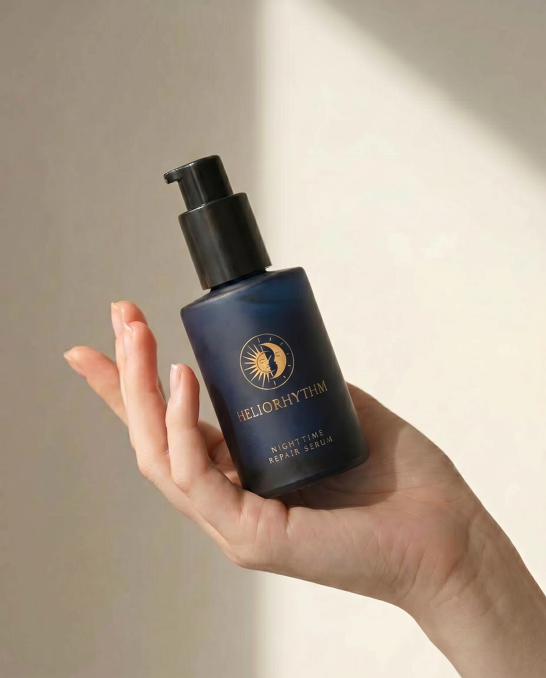 Hand holding HelioRhythm Nighttime Repair Serum